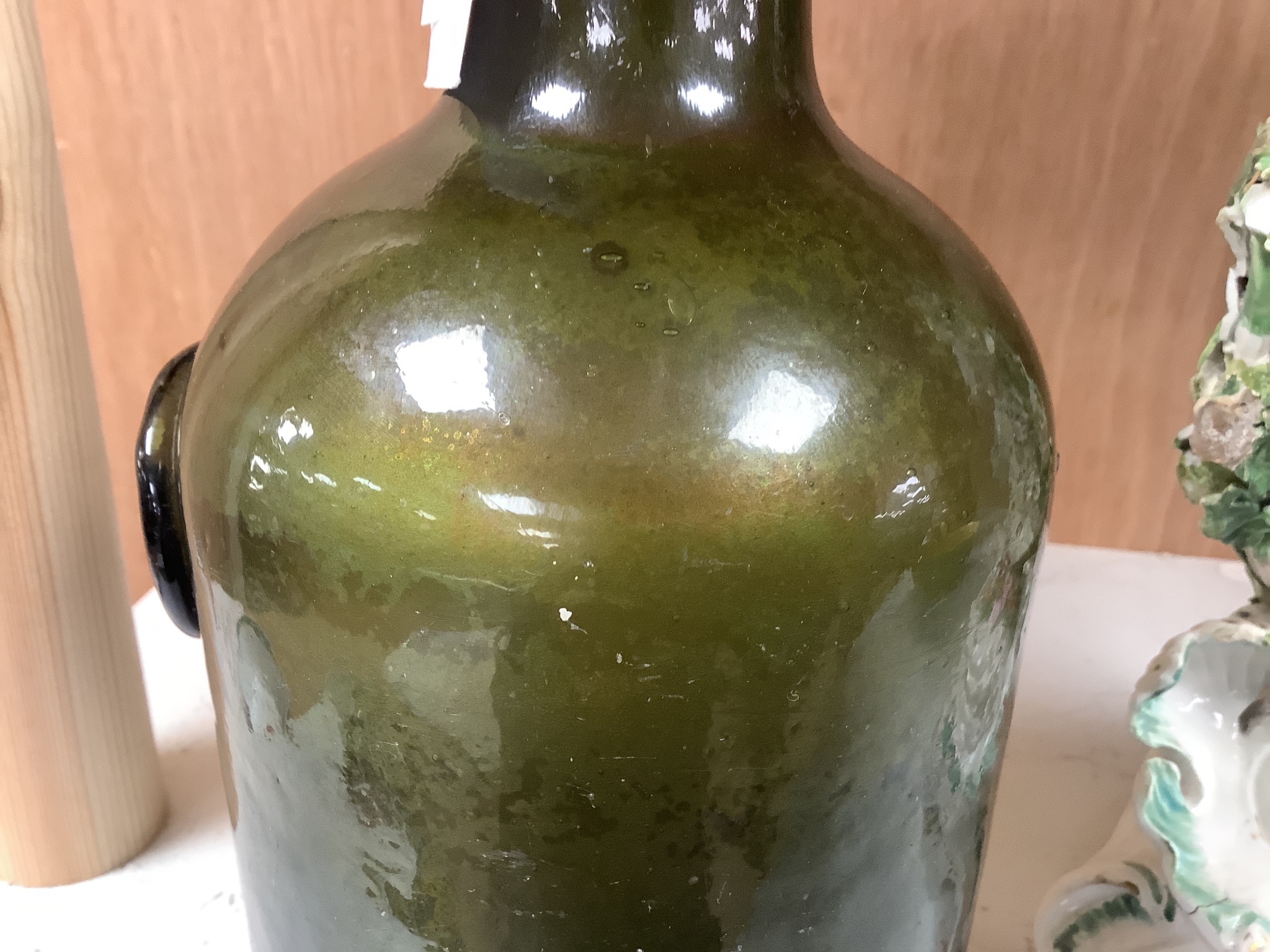 A George III green glass sealed wine bottle, dated 1778 26cm